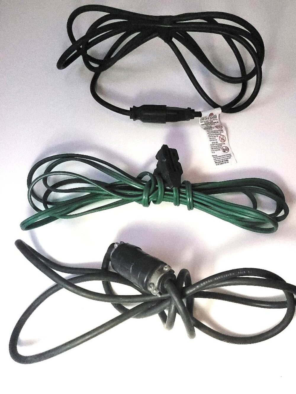 Bundle of 3 functional extension cords of various lengths. Home or yard